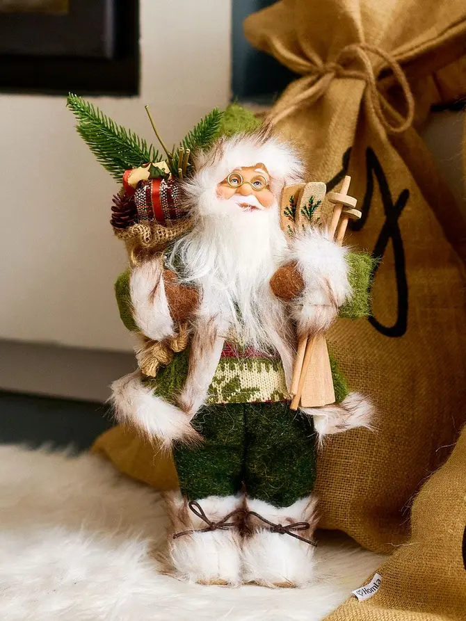 Skrzat CLAUSE Mikołaj zielony z nartami i workiem 30 cm
