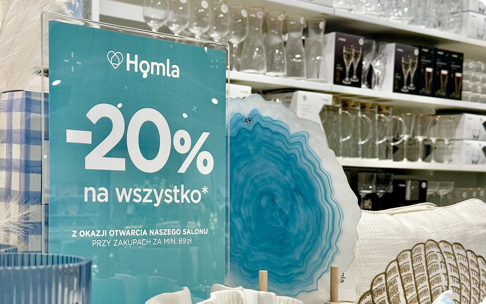 HOMLA in-store promotional campaign with discount signage